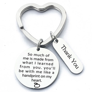 Detail view of heart-shaped stainless steel teacher appreciation keychain with engravings
