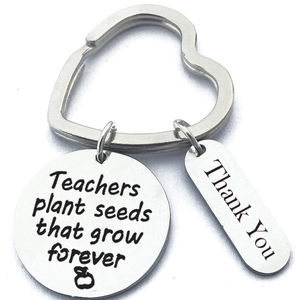 Detail of teacher appreciation keychain with engraved heart ring and stainless steel charms