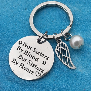 Stainless steel friendship keychain with feather charm and sisterhood heart engraving