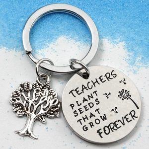 Stainless steel teacher keychain with tree charm and engraved inspirational message