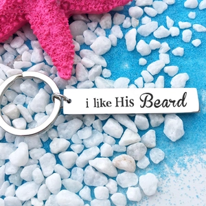 Polished stainless steel keychain with i like His Beard engraving on a beach background