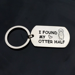 Polished silver metal keychain engraved with I Found My Otter Half and a heart