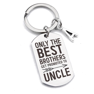 Stainless steel uncle keychain with engraved text and an initial A charm on white background