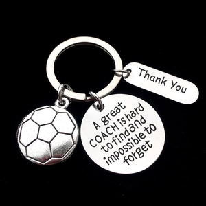 Detailed view of stainless steel soccer coach keychain with engraved thank you message tags