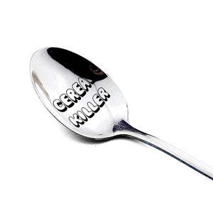 Polished stainless steel spoon featuring a Cereal Killer engraved slogan design