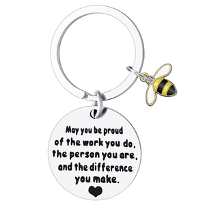 Stainless steel bee keychain with motivational engraving and yellow honey bee charm