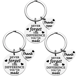 Three stainless steel retirement keychains with heart charm and motivational text