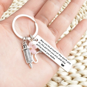 Medical nurse gift keychain with syringe charm and inspirational quote engraving