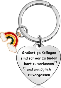 Macro shot of stainless steel heart keychain with rainbow charm and German engraving