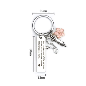 Medical keychain with stethoscope charm and quote May you be proud of the work you do