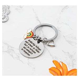 Close-up of German engraved stainless steel keychain with rainbow heart and cloud charms