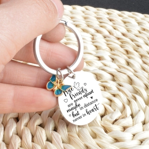 Stainless steel friendship keychain with butterfly charm and engraved round quote tag