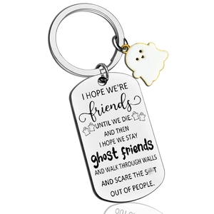 Detail view of stainless steel ghost keychain with I Hope We're Friends engraving