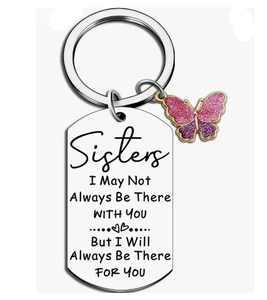 Detailed close-up of engraved inspirational message on silver stainless steel keychain