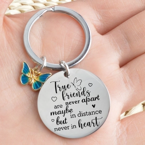 Polished stainless steel friendship keychain with blue enamel butterfly and engraved quote