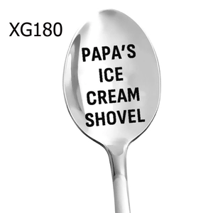Macro shot of mirror-polished stainless steel spoon with Papa's Ice Cream Shovel engraving