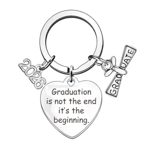 Detailed view of the Class of 2026 graduation keychain with heart-shaped inspirational charm