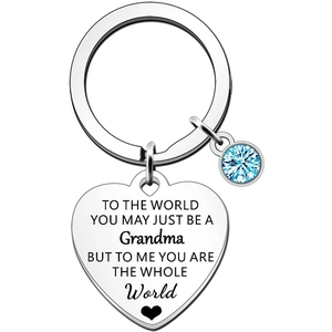 Detailed view of silver heart keychain with blue birthstone and engraved quote for grandma