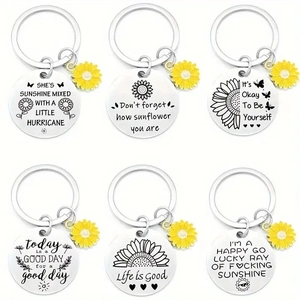Detail view of 6-piece sunflower stainless steel keychains with inspirational engravings
