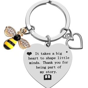 Stainless steel teacher keychain with bee and heart charms and inspirational text engraving