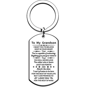 Detail of engraved dog tag keychain for grandson with motivational text and star icons