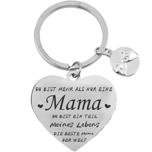 Detail of silver heart keychain with German engraving and hand-holding charm