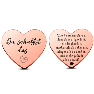 Detail of rose gold lucky coins with German motivational text and clover engraving