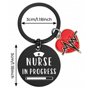 Black stainless steel Nurse in Progress keychain with red heart charm gift for nurses