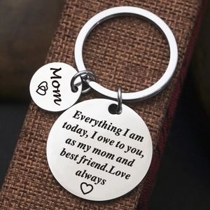 Polished stainless steel Mom keychain with heart pendant on brown gift box