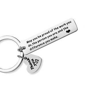 Polished stainless steel keychain with engraved motivational quotes and a heart-shaped charm