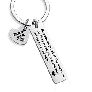Stainless steel keychain with heart and bar charms featuring inspirational engraving