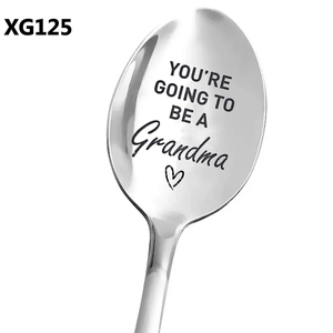 Close-up of stainless steel spoon with You Are Going To Be A Grandma engraving
