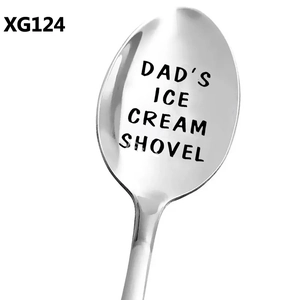 Detail view of the engraved text DAD'S ICE CREAM SHOVEL on the polished stainless steel spoon