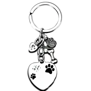 Close-up of stainless steel heart pendant with pet memorial engraving and bone charms