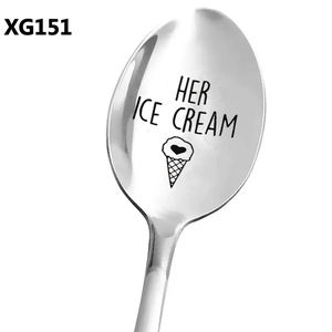 Macro shot of silver stainless steel spoon with HER ICE CREAM heart engraving