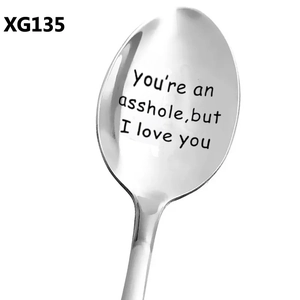 Detailed view of polished stainless steel coffee spoon with humorous engraved quote
