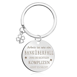Detail view of silver stainless steel keychain with clover charm and German laser engraving