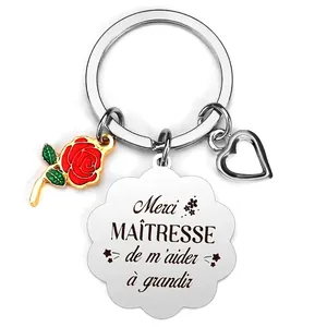Silver teacher keyring with red rose and French engraved quote on white background