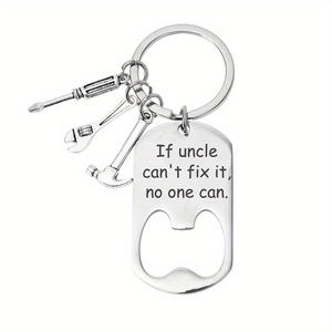 Detail of metal multi-tool keychain with mini hammer, wrench and uncle gift engraving