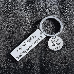 Polished stainless steel sister keychain with humorous engraving and Best Sister Ever charm