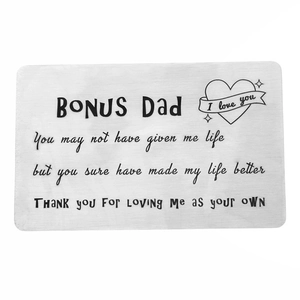 Detailed macro view of brushed stainless steel wallet insert card with bonus dad message