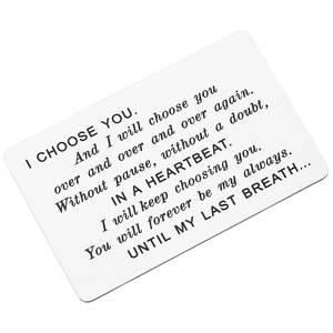 Close-up of polished stainless steel wallet card insert with laser engraved romantic text
