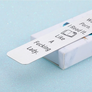 Funny stainless steel bookmark with humorous quote on white marble gift box