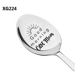 Detail view of engraved Cat Mom and Good morning text on a stainless steel spoon