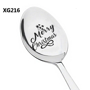 Macro shot of silver stainless steel spoon with Merry Christmas laser engraving