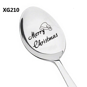 Detail of Christmas spoon with laser engraved Merry Christmas and Santa hat pattern
