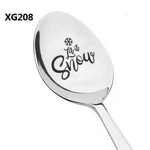 Macro detail of 'Let it Snow' laser engraving on a stainless steel Christmas spoon