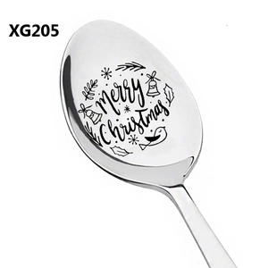 Detail of laser engraved Merry Christmas text and holiday motifs on a stainless steel spoon