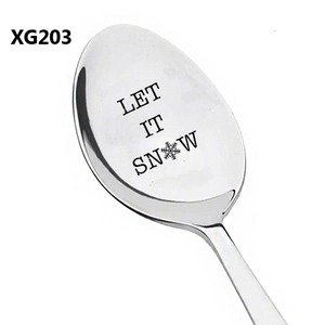 Detailed macro view of stainless steel coffee spoon with Let It Snow engraving