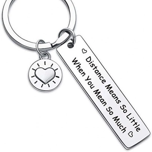 Stainless steel friendship keychain with engraved sentimental quote on white background